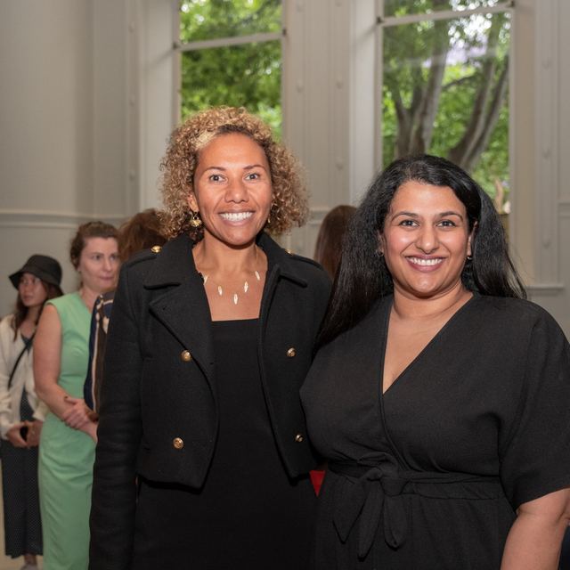 Two women standing together at a Spark Festival reception